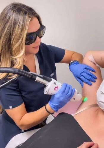 Accesa Health nurse performing laser hair removal on armpits underarms